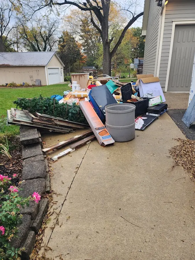 Dumpster being loaded with debris for Commercial Dumpster Rental in Merriam